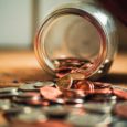 Photo of coins spilling out of a jar, by Josh Appel on Unsplash